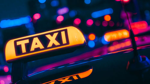 Close-up of  a taxi sign in the city at night 