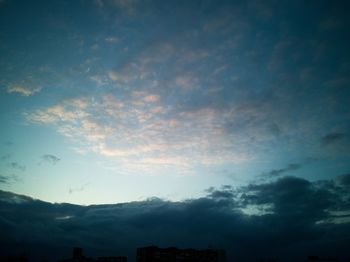 Low angle view of silhouette mountain against sky