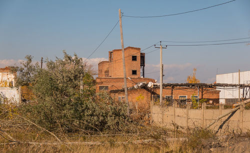 Abandoned building against clear sky