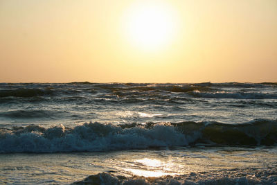 Scenic view of sea against clear sky during sunset