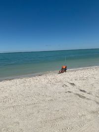 Scenic view of beach against clear sky