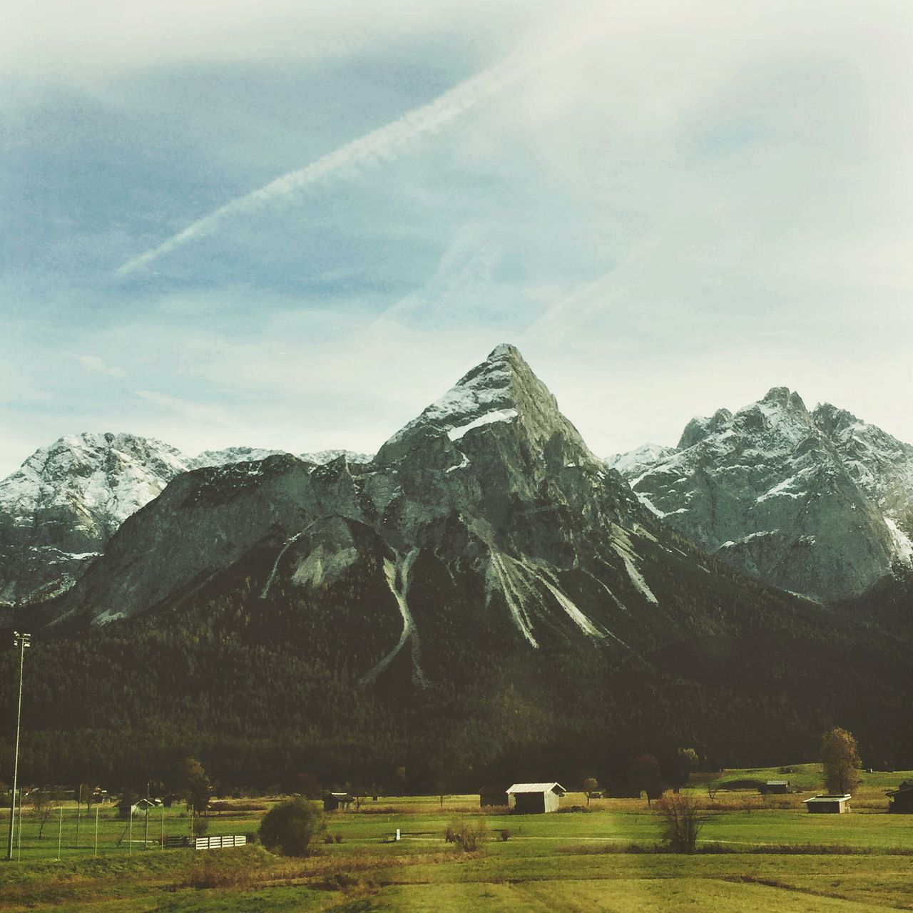 mountain, snow, mountain range, landscape, winter, tranquil scene, scenics, cold temperature, sky, tranquility, beauty in nature, snowcapped mountain, nature, tree, non-urban scene, weather, season, field, house, building exterior