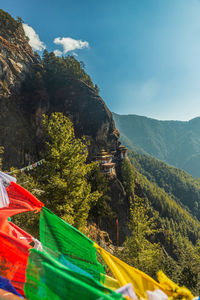 Scenic view of green mountains against sky