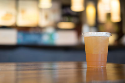 Close-up of beer glass on table