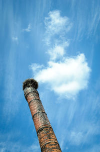 Low angle view of smoke stack against sky