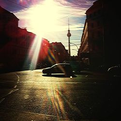 Sun shining through city