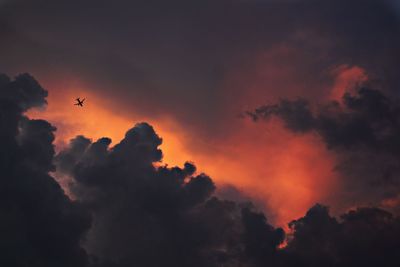 Low angle view of cloudy sky at sunset