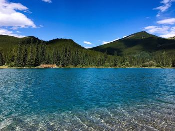 Scenic view of mountains against blue sky