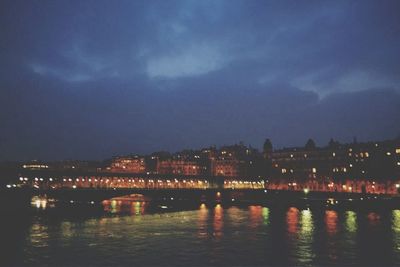 Reflection of illuminated buildings in water