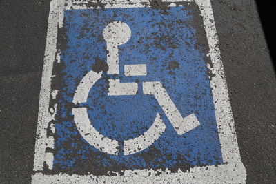 High angle view of disabled sign on road