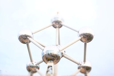 Low angle view of ferris wheel against sky