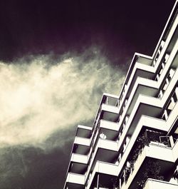 Low angle view of building against cloudy sky
