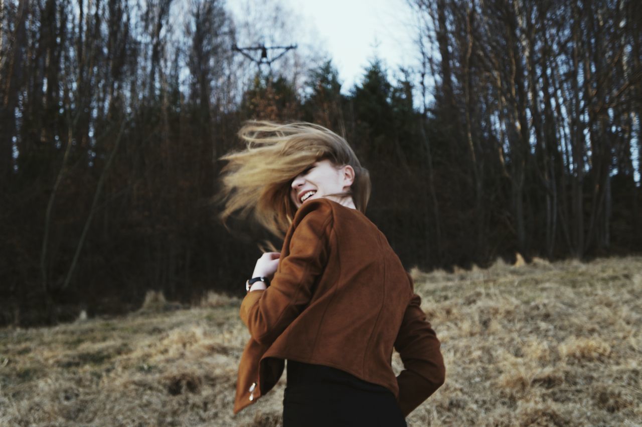 one person, sweater, young adult, blond hair, nature, tree, winter, warm clothing, people, outdoors, forest, field, women, scarf, adult, adults only, landscape, one young woman only, day, young women, one woman only, only women, human body part, sky