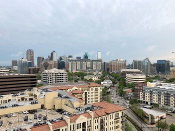 High angle view of buildings in city against sky