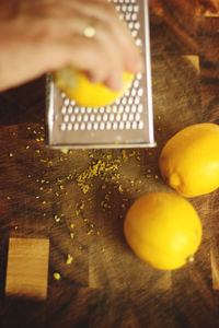 Close-up of yellow lemons on cutting board