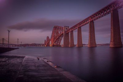 Golden gate bridge over river against sky