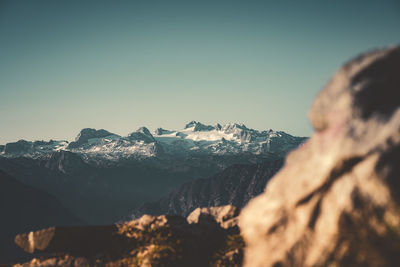 Scenic view of snowcapped mountains against clear sky