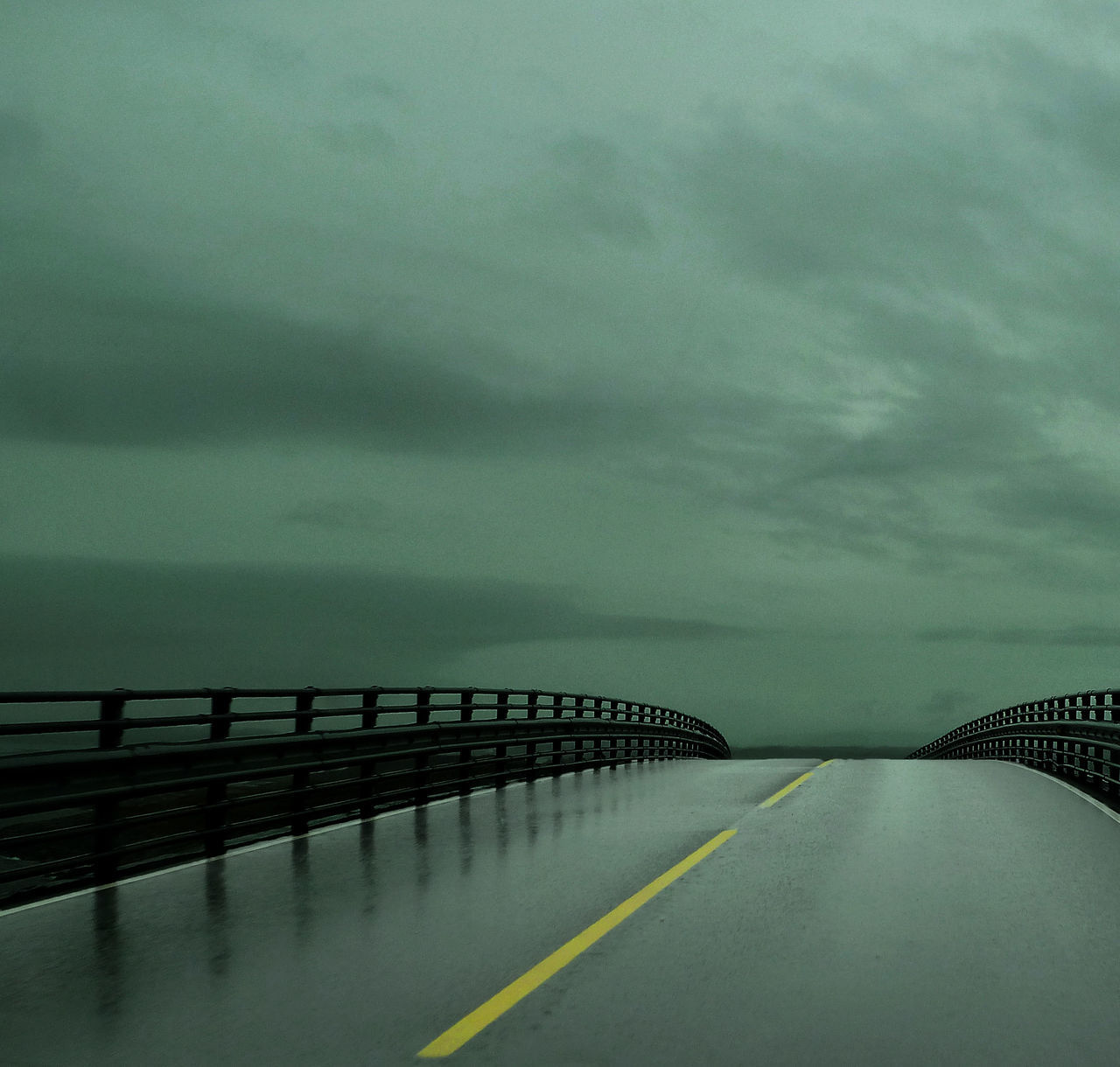 water, sky, the way forward, railing, sea, cloud - sky, diminishing perspective, transportation, tranquility, bridge - man made structure, tranquil scene, connection, scenics, cloudy, long, nature, pier, beauty in nature, weather, vanishing point