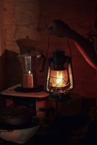 Close-up of illuminated lamp on table