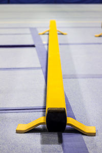 High angle view of yellow table on tiled floor