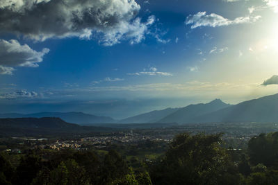 Scenic view of mountains against blue sky