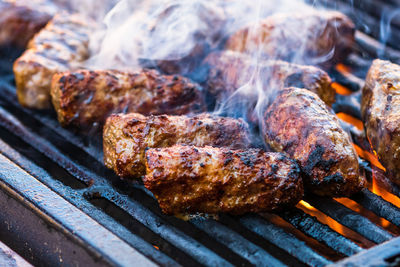 Close-up of meat on barbecue grill