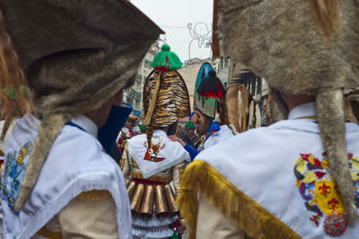 Rear view of man with arms raised