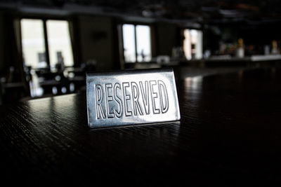 Close-up of text on table at restaurant