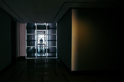 View of a photographer in a corridor of a building