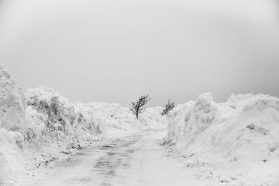 Scenic view of snow covered landscape against sky