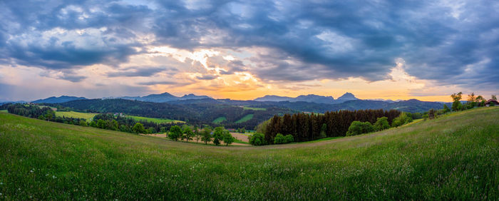 Scenic view of landscape against sky during sunset