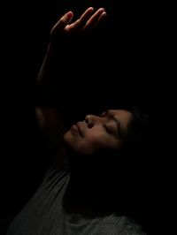 Close-up of woman in darkroom