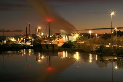 Illuminated boats moored at night