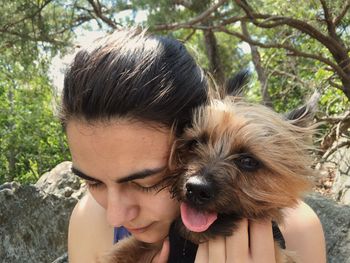 Close-up of woman with australian silky terrier