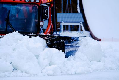 Snow covered boat at winter