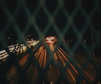 High angle view of light trails on road at night