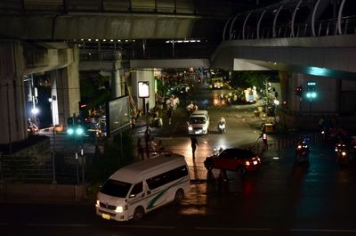 Cars on road in city at night