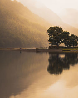 Scenic view of lake against sky during sunset