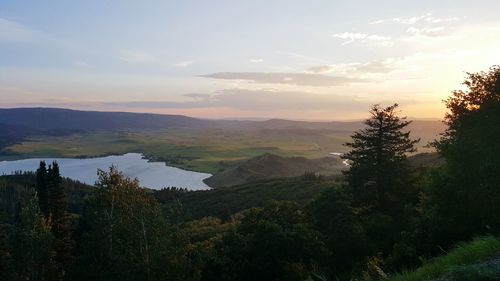 Scenic view of mountains against sky at sunset