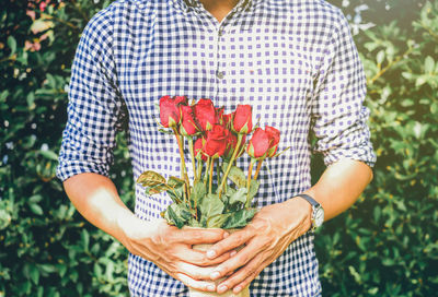 Close-up of woman holding bouquet