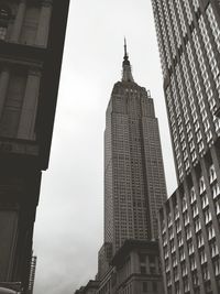 Low angle view of buildings in city against sky