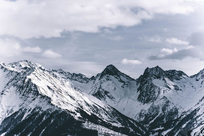 Scenic view of snowcapped mountains against sky