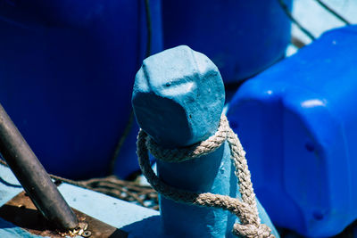 Close-up of rope tied on metal