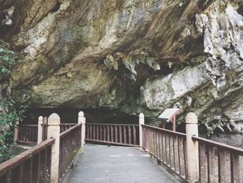 Bridge leading towards cave