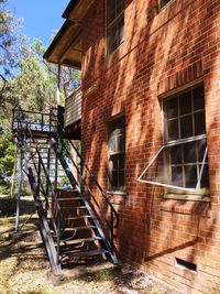 Staircase by building against sky