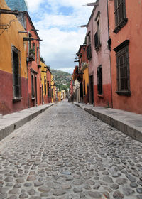 Surface level of alley amidst buildings in town