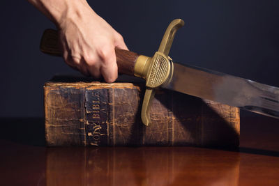 Close-up of hand holding book