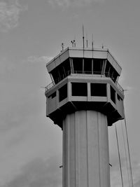 Low angle view of air traffic control tower against sky