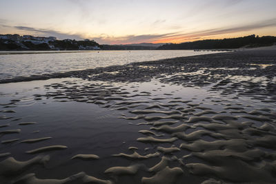 Scenic view of beach during sunset