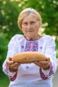 Portrait of woman holding food